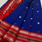 Open red pallu showing repeated pale Kamalam flower rows, green thread bands and blue red tasselled edge