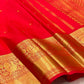 Vermilion Red KanchiPattu saree body close-up with gold zari buttas