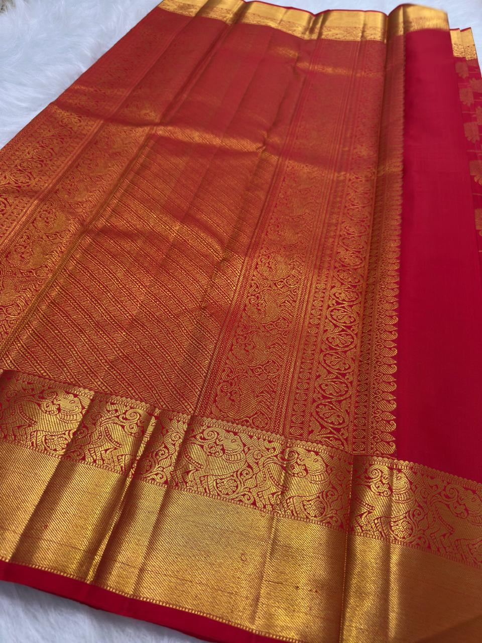 Bright red Pure Silk Kanchipuram saree with an all-over jaal design