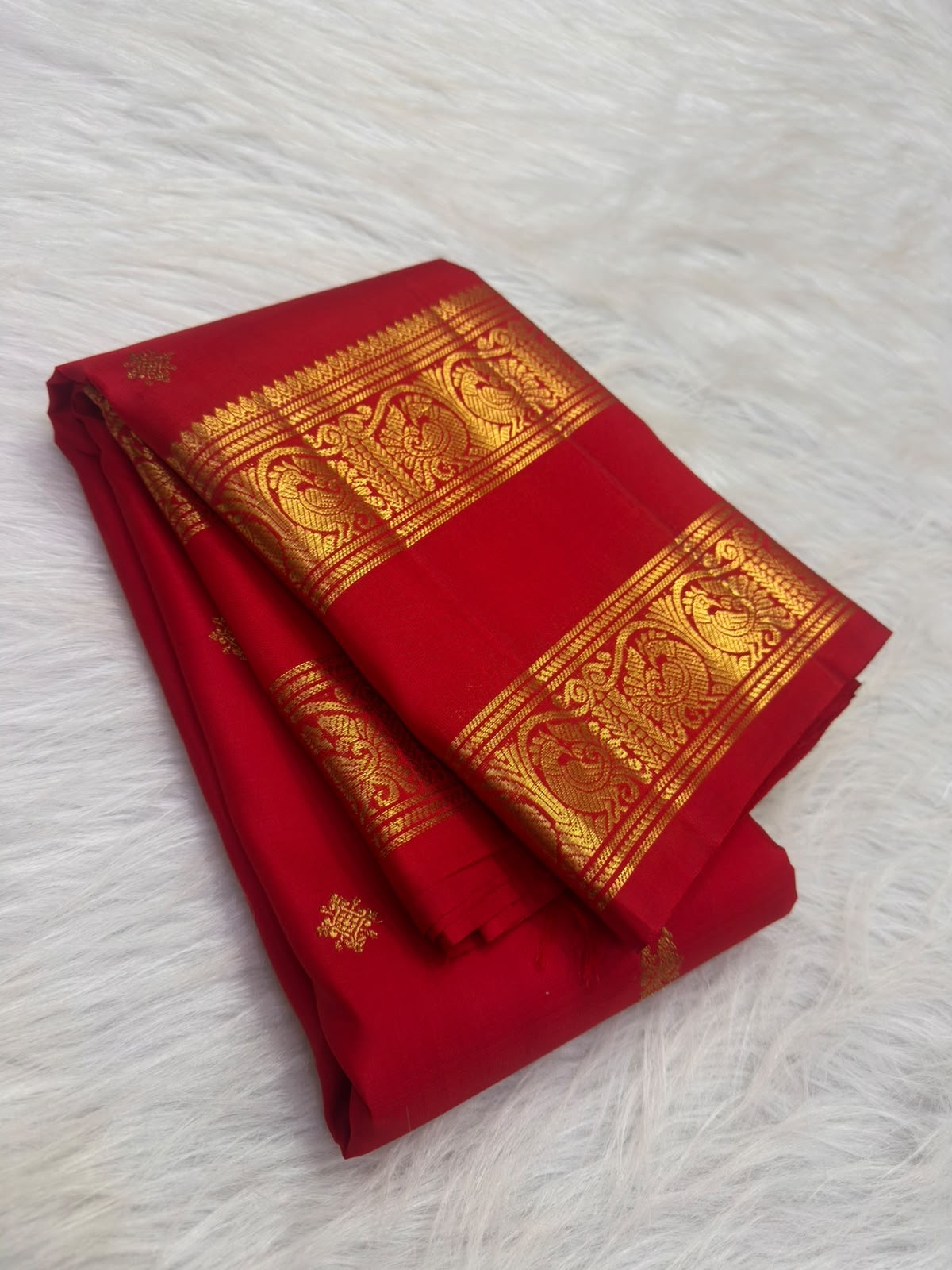 Vermilion red Kanchipuram silk saree with gold Yazhi border, full view