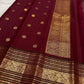 Deep Arakku red Pure Silk Kanchipuram Varisaipet saree with a peacock-arch zari border.