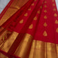 Vermillion red pure silk Kanchipuram Butta saree, with floral-drop zari buttas and broad gold border