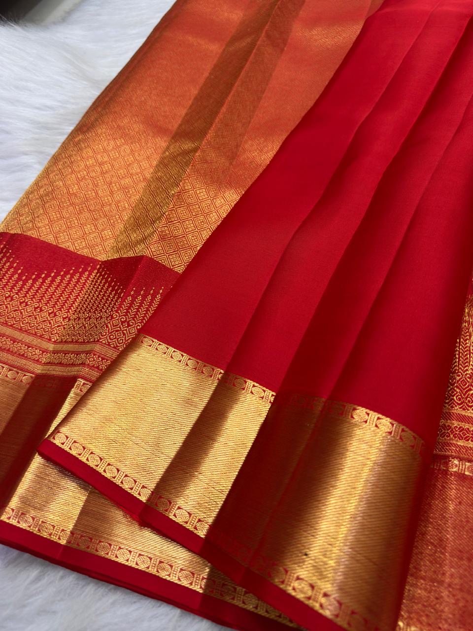 Pure Silk Kanchipuram Butta saree with broad antique gold zari border
