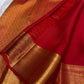 gold border detail of vermilion red Kanchipuram silk saree