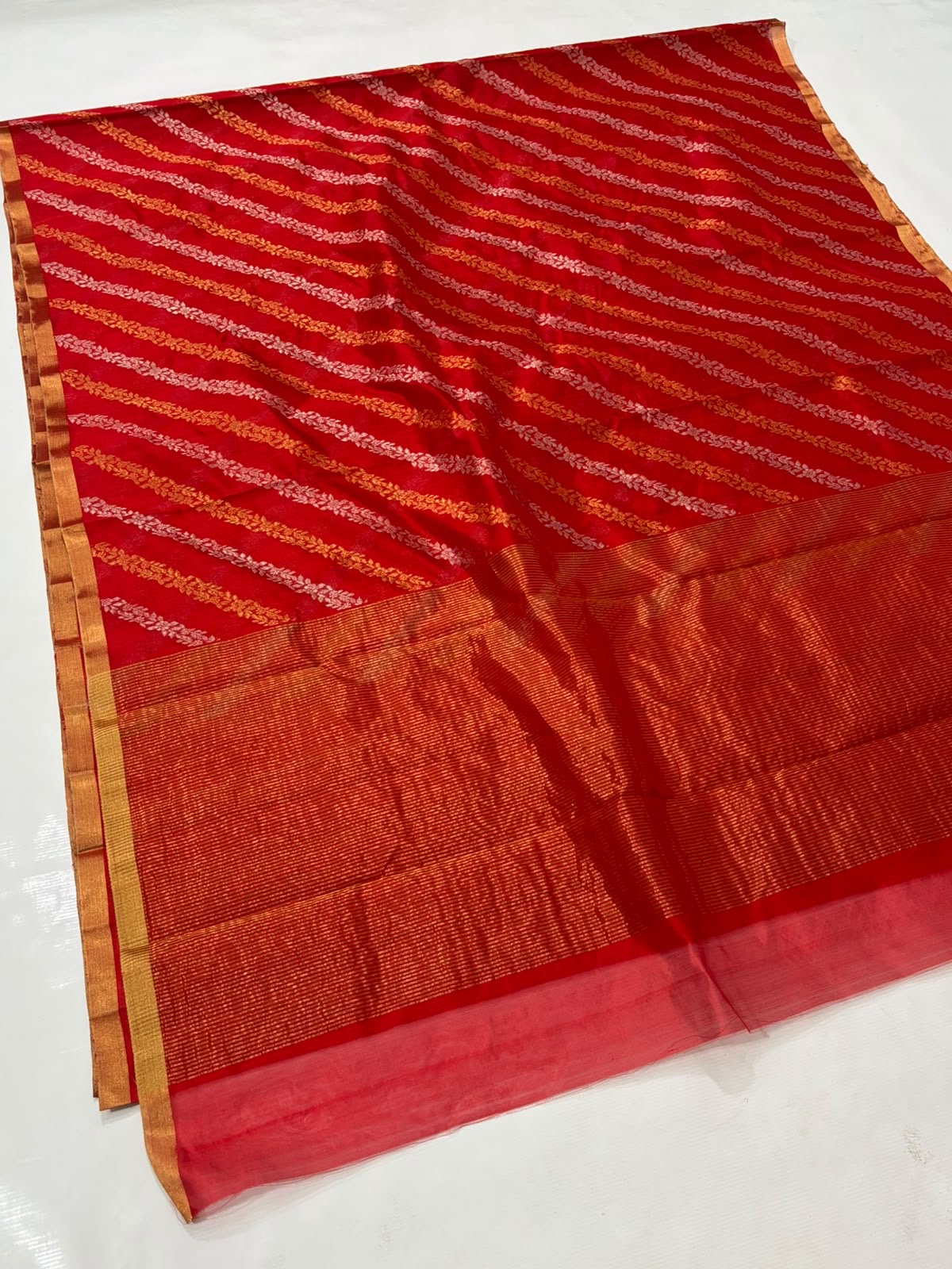 Vermilion Red handloom Pattu Silk Chanderi saree with orange and rose woven stripes, gold edging and metallic pallu