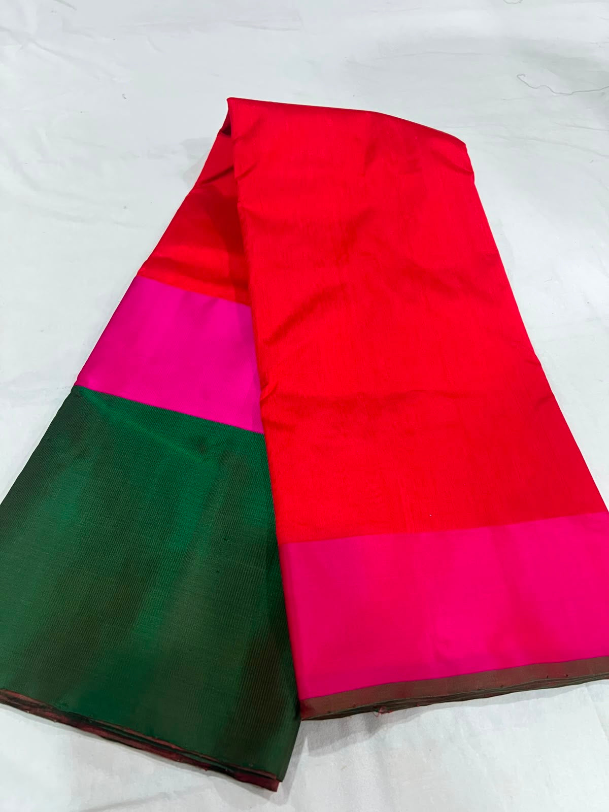 Vermilion red Pattu Silk Chanderi saree with rani pink and emerald green Mashru border