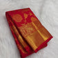 Close-up of the gold zari floral jaal on a vermilion red silk saree