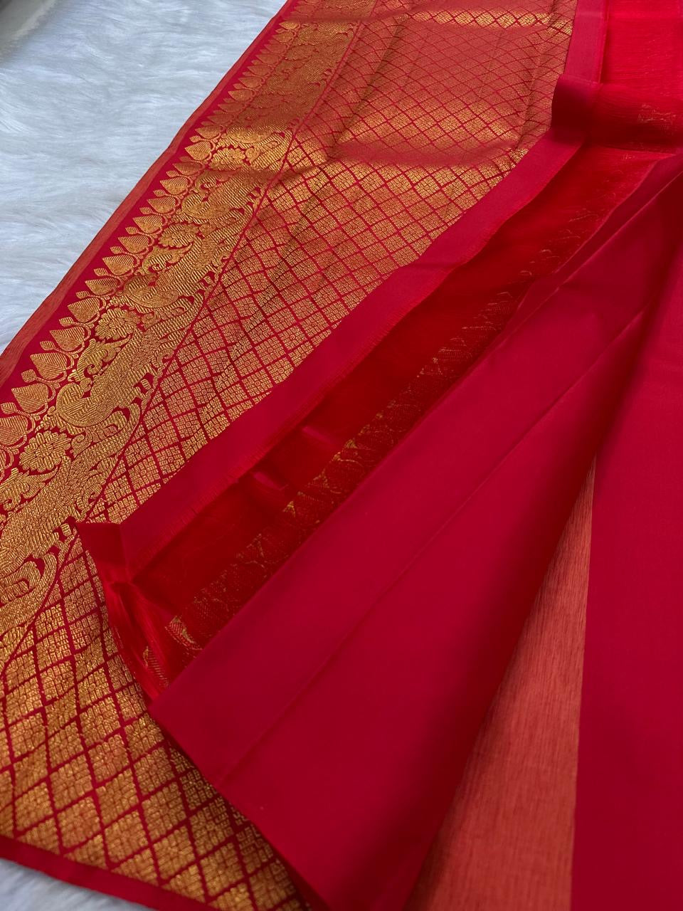 Traditional Butta Kanchipuram saree in vermilion red and warm gold