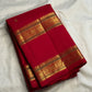 Red handwoven Kanchipuram silk saree with intricate parallel Rettapet gold zari borders.