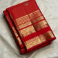 Vermilion red Pure Silk Kanchipuram saree with fine zari lattice and alternating gold and silver-toned buttas.
