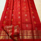 Handwoven vermilion silk body showing fine gold zari Kattam lines and scattered woven motifs.