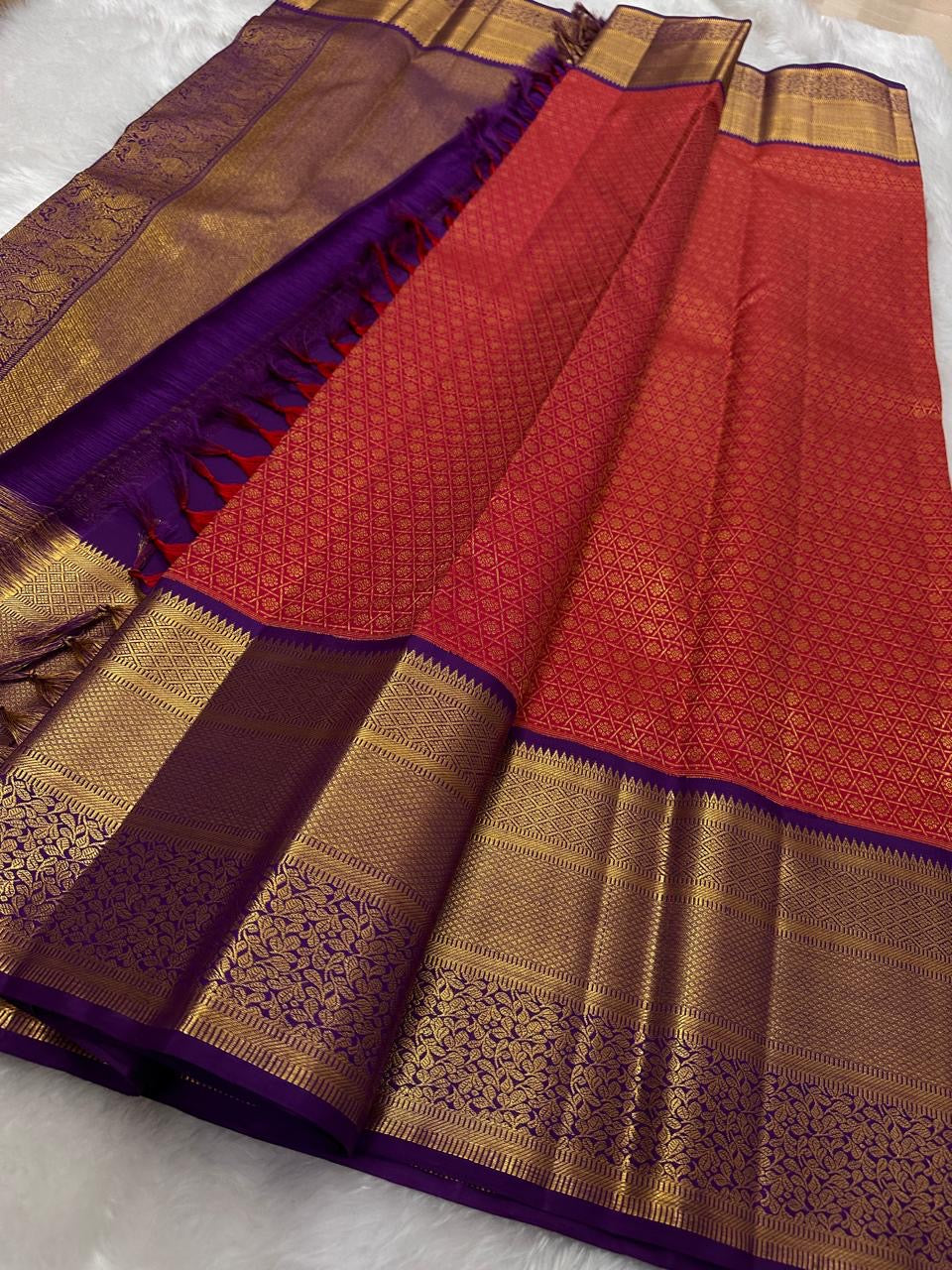 Fine gold-zari diamond geometry across Vermilion Red Kanchipuram silk.
