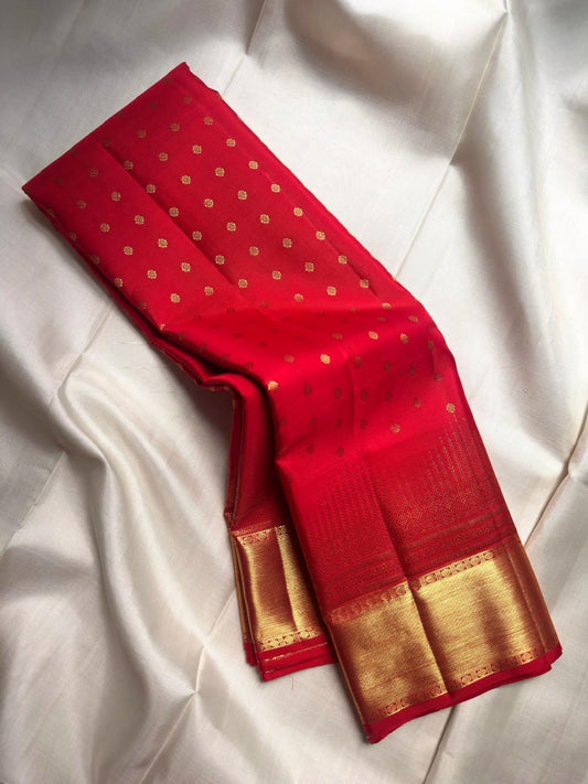 Vermilion Red Pure Silk Kanjivaram Butta saree with antique gold zari buttas