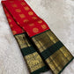 Vermilion red Pure Silk Kanjivaram saree draped, showing oversized mayil and kamalam buttas