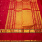 Vermilion Red pure silk Kanjeevaram Rettapet saree with spaced gold zari buttas and traditional gold border.