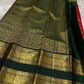 Full view of the vermilion red Rettapet silk saree with bottle green border