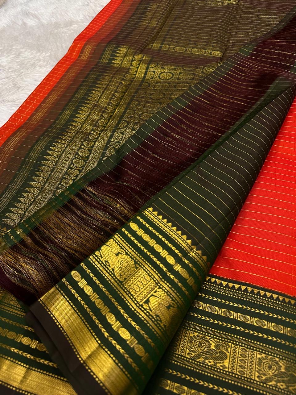 Vermilion red Pure Silk Kanjivaram Varisaipet saree with gold zari bands and heirloom craftsmanship