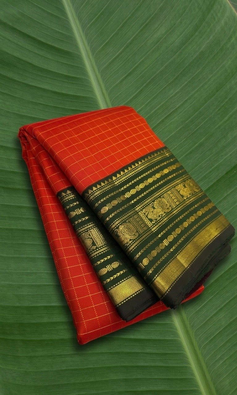 Pure Kanchipuram silk saree in vermilion red with forest green Varisaipet border and antique gold zari