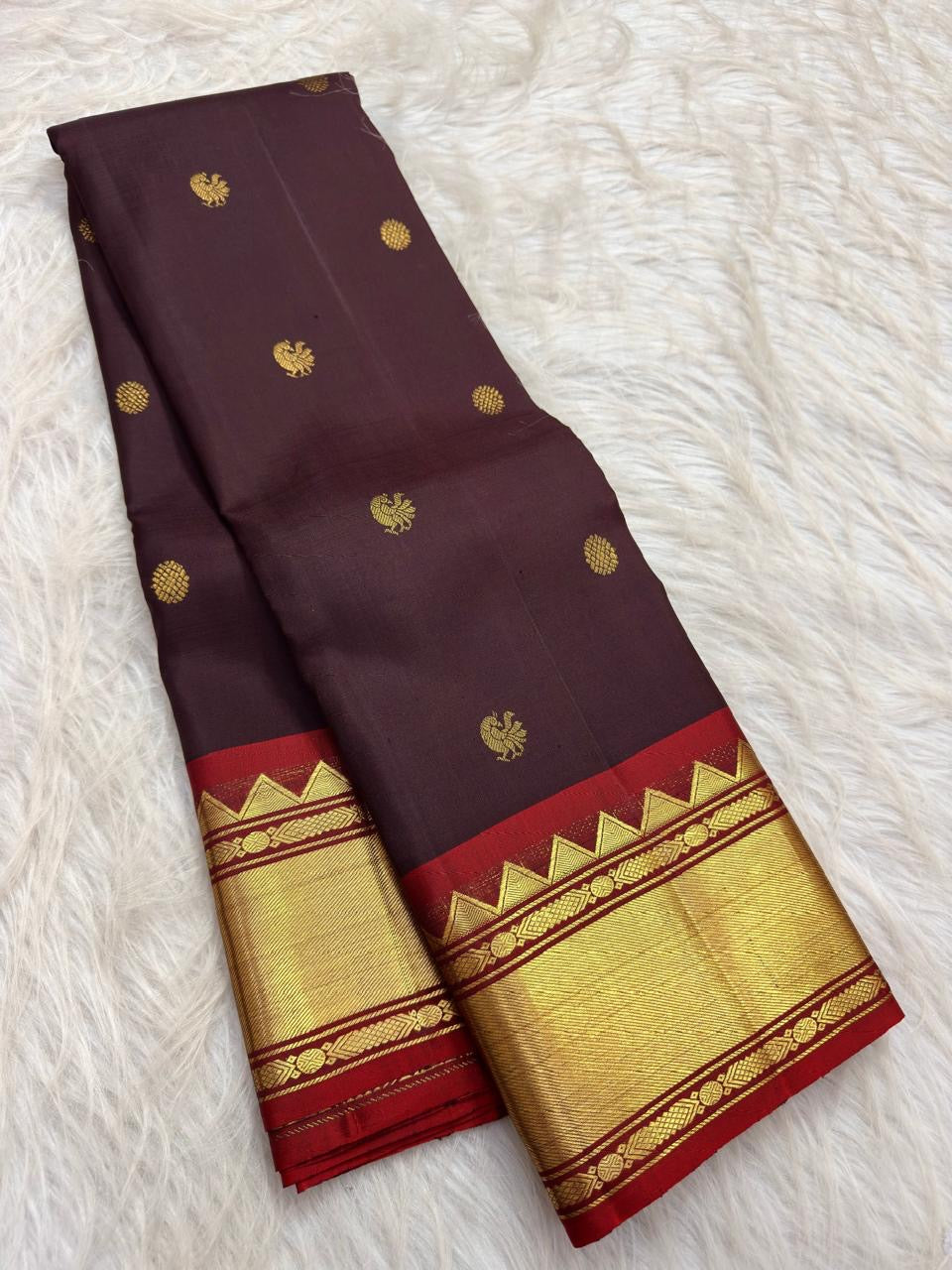Deep Paaku brown handwoven pure silk Kanjivaram Korvai saree with vermilion zari border and Mayil Chakram buttas, main view