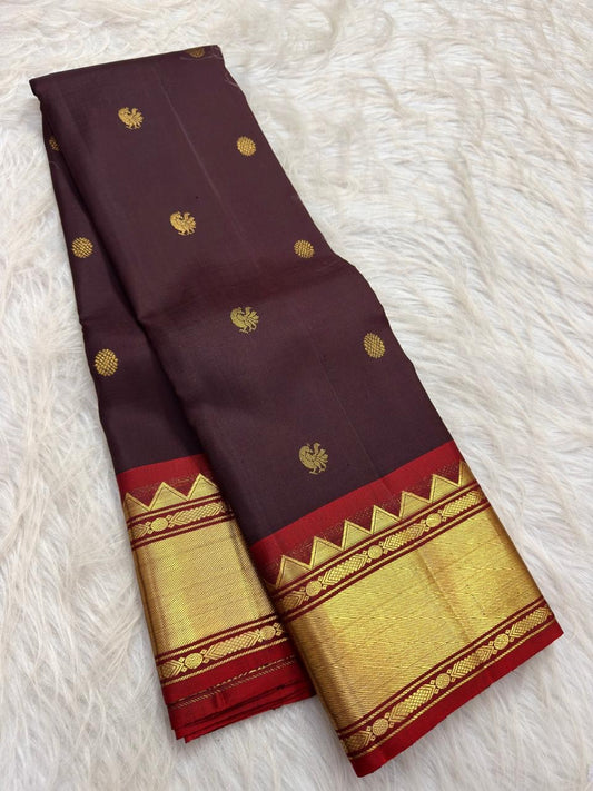 Deep Paaku brown handwoven pure silk Kanjivaram Korvai saree with vermilion zari border and Mayil Chakram buttas, main view