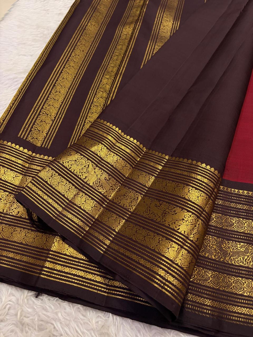 Vermillion red Kanjeevaram silk saree with delicate small zari butta detail