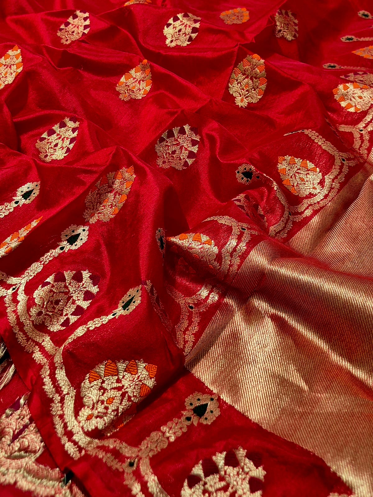 Vermillion red Chanderi silk saree showing multicolour ornamental border and luminous metallic pallu