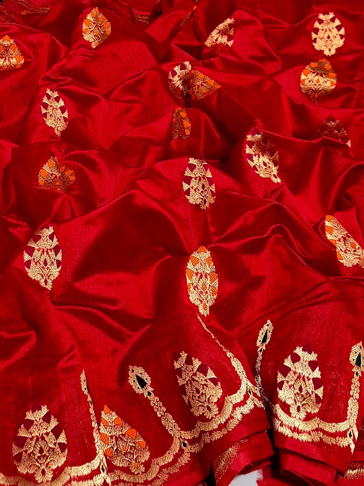 Vermillion red handloom Pattu Silk Chanderi saree with gold woven motifs and orange magenta accents