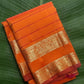 Kanchipuram silk saree in sunset orange with reddish pink border Veldhari Rettapet weave folded view