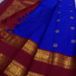 Draped Pure Kanchipuram silk saree with maroon zari woven pallu and blue tassels, shipped from New Jersey USA.