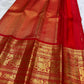 Kanchipattu silk saree in vibrant kumkum red with antique gold border Vanasringaram weave traditional zari detail