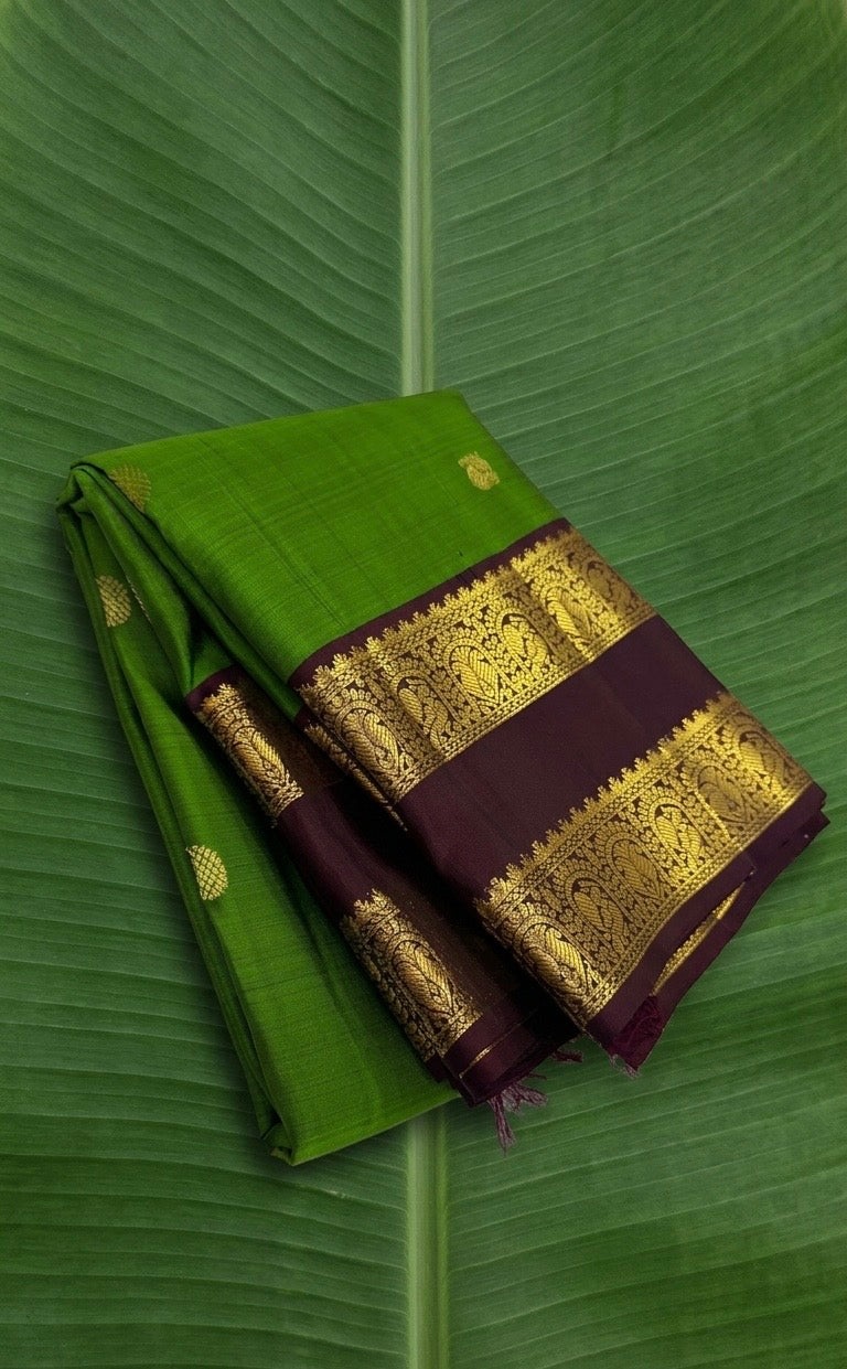Parrot green Kanchipuram silk saree with deep coffee brown rettapet border and gold zari Idam Living