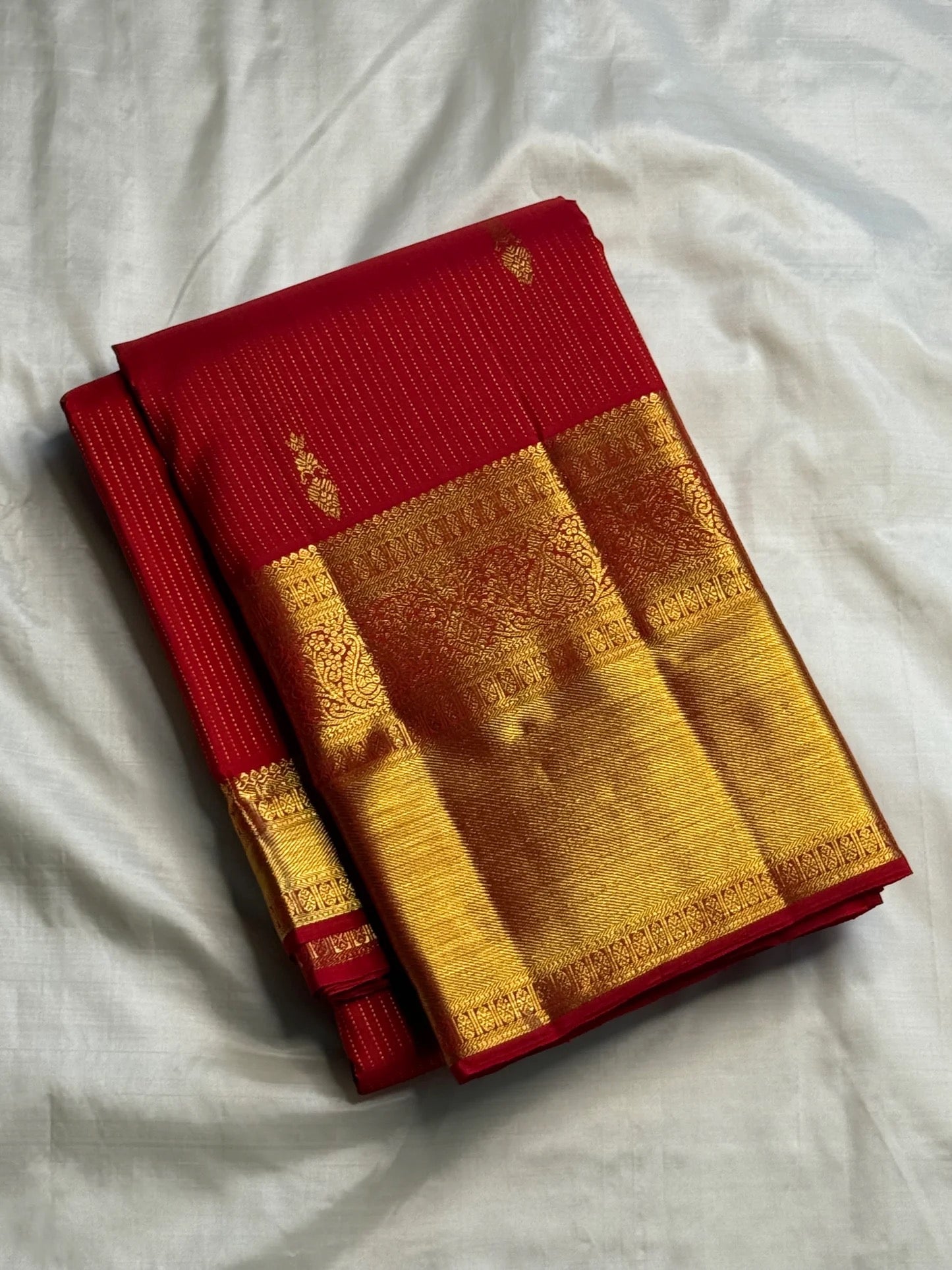 Pallu detail on vibrant red handwoven Kanchipuram pure silk saree — Idam Living