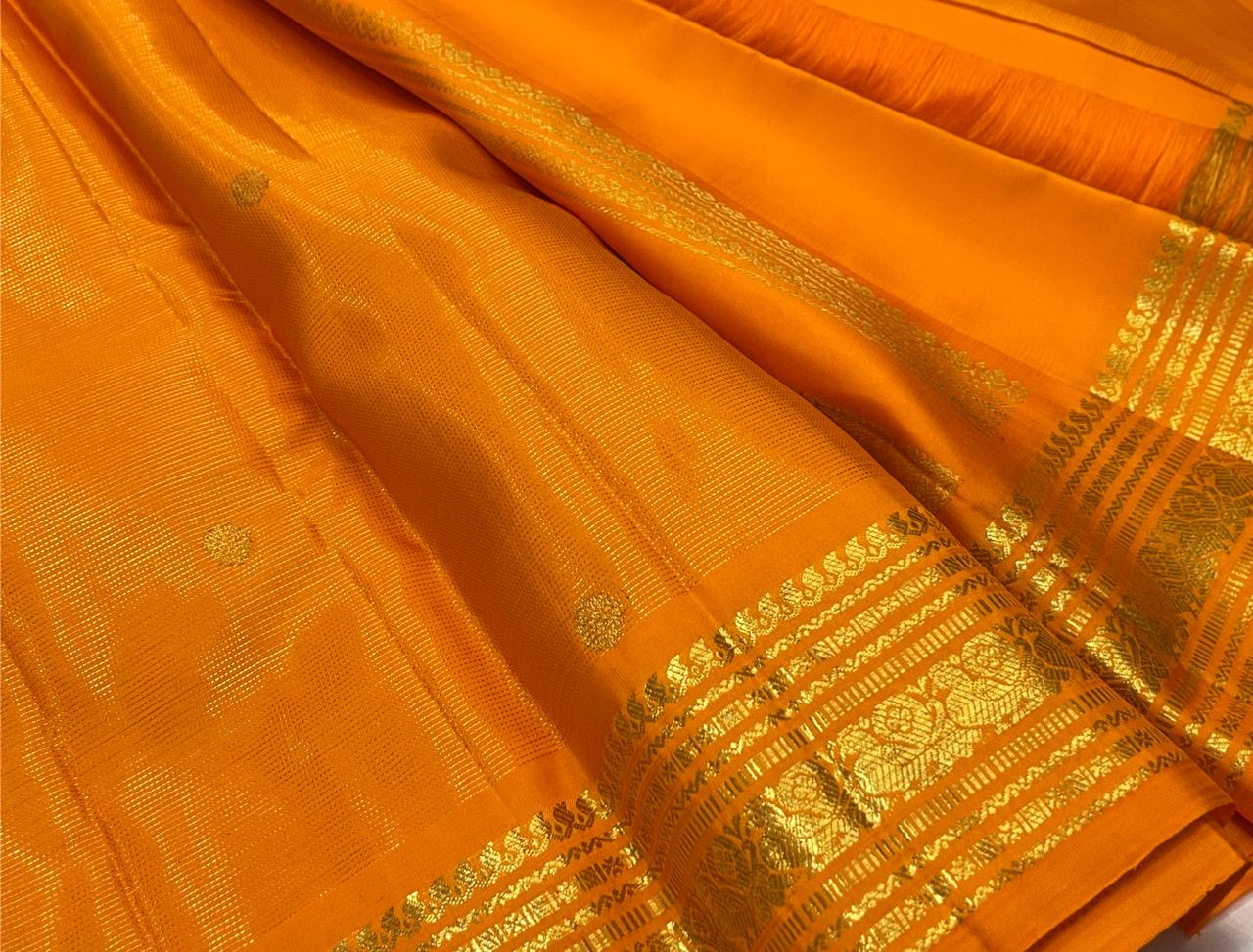 Vintage 2gram zari detail on a Saffron Orange Vairaoosi Kanchipuram saree.