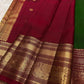 Close view of a Yaanai Ambari gold-zari butta on vintage green Kanchipuram silk.
