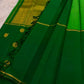 Vintage green pure silk Kanjivaram saree with restrained gold zari border and traditional motifs.