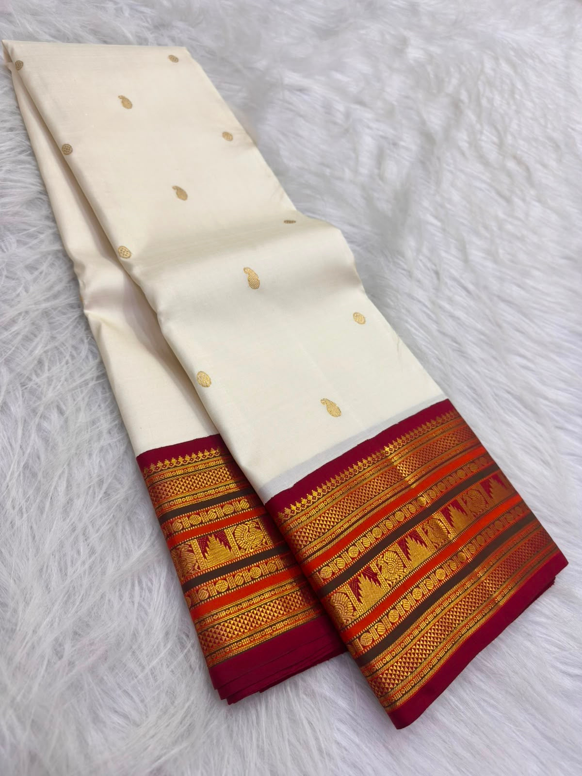 Warm-ivory pure silk Kanchipuram Korvai saree with Sevvanthi rust-orange border, full drape — Idam Living