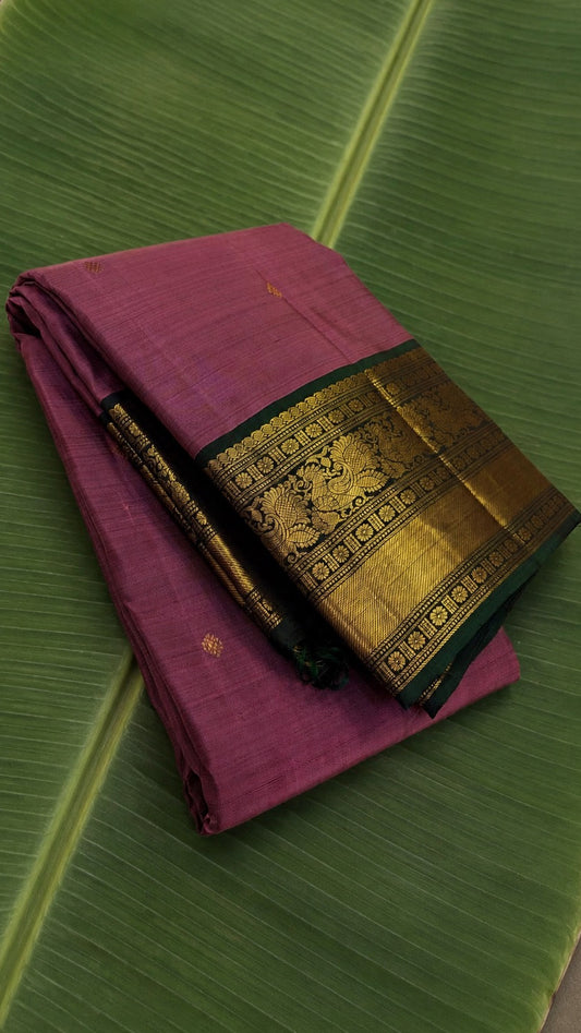 Muted rose gold Kanjivaram silk saree with traditional antique zari border