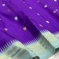 Royal violet blue Kanjeevaram silk saree body close-up showing Mayil Chakram circular peacock medallion buttas in silver zari
