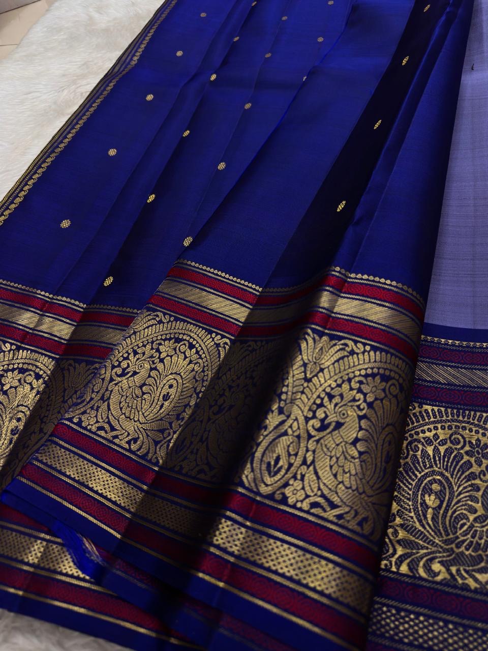 Violet border Kanjeevaram silk saree with pink silk thread and traditional zari detailing
