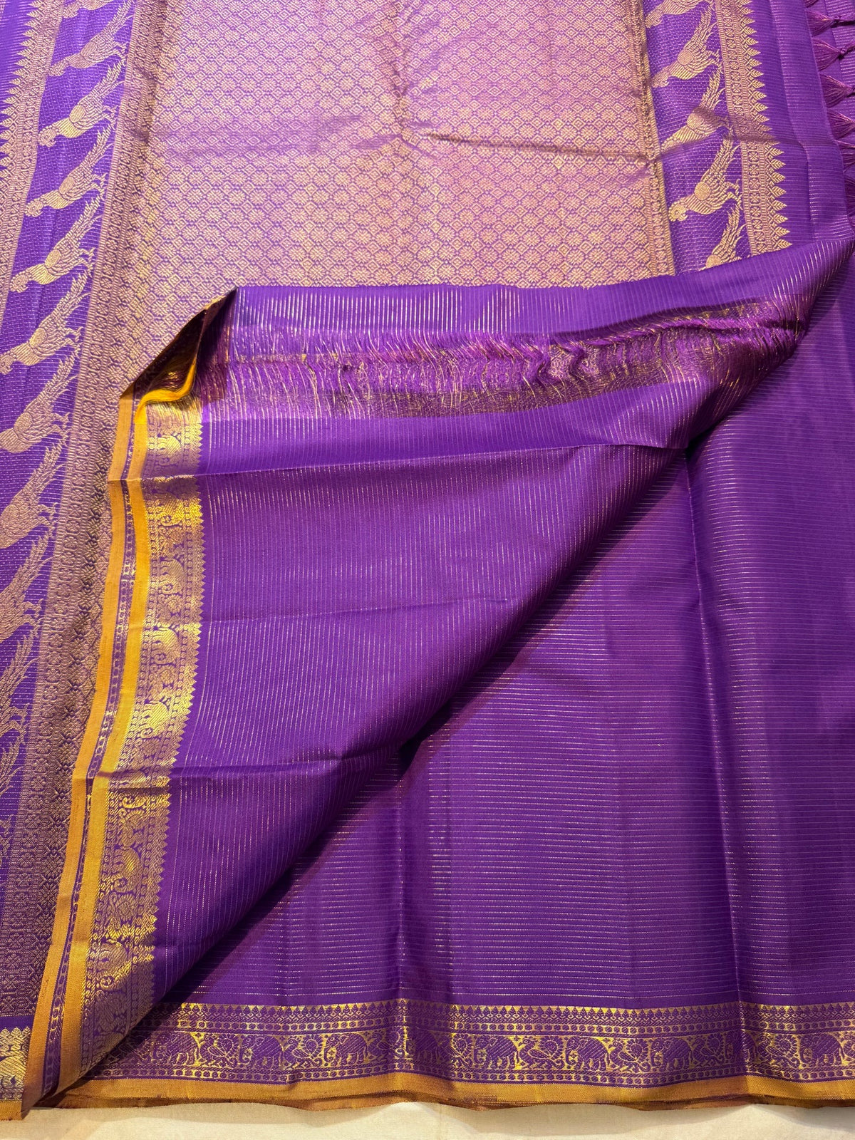 Royal Purple pure silk saree with continuous needle-like Vairaoosi gold zari weaving.