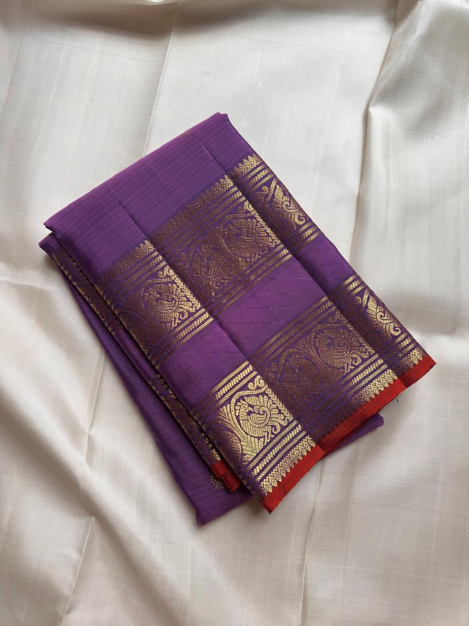 Kathiripoo Violet Handwoven Pure Silk Kanchipuram Saree with Rettapet Mayil Zari Border and Orange-Red Selvedge