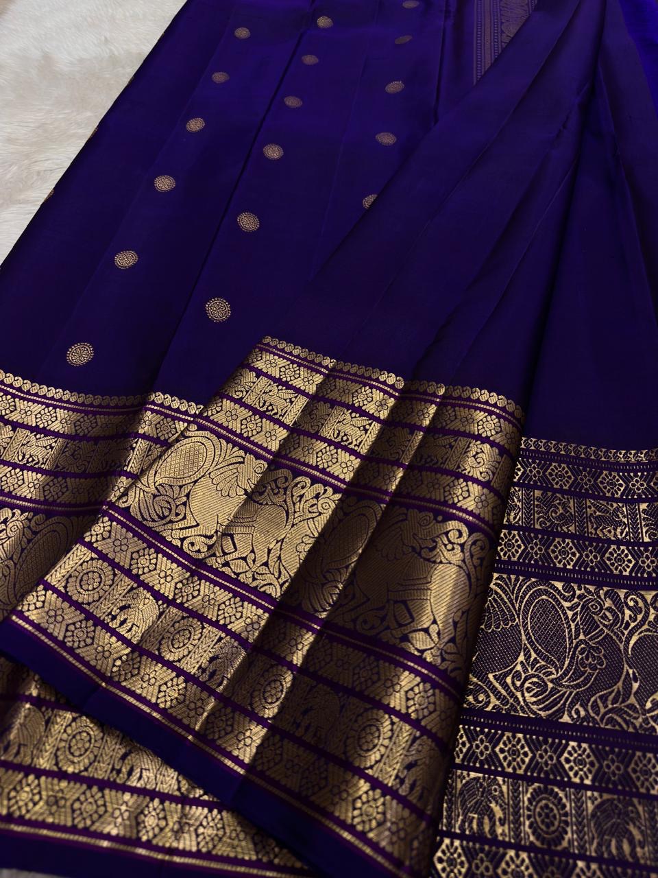 Pure silk Kanchivaram Korvai saree with ornamental medallions and antique gold zari weaving