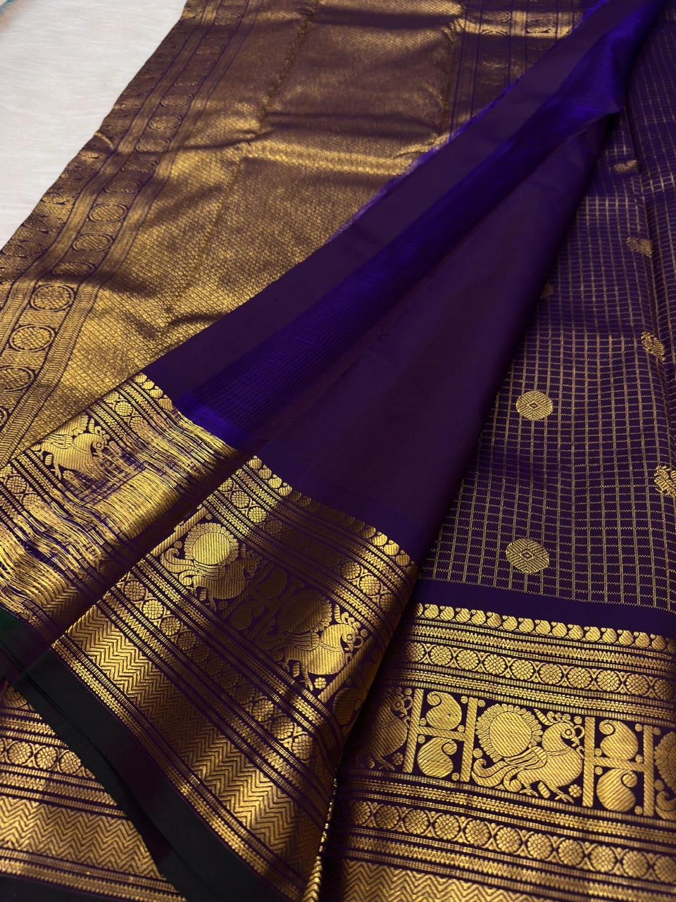 Purple Kanjipuram saree with Arakku gold pallu
