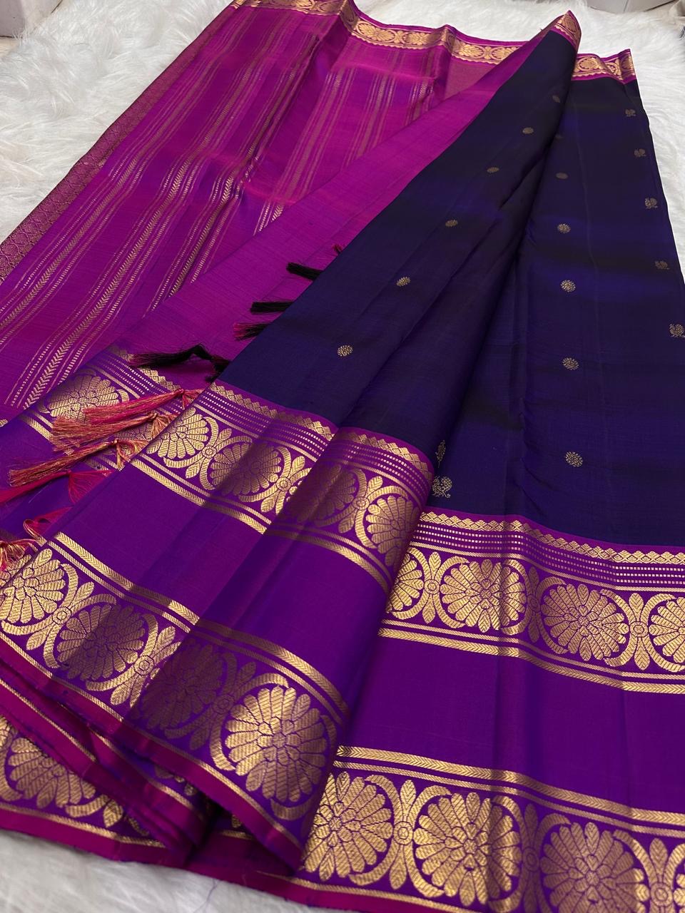 Handwoven Kanchipuram saree showing contrast between royal violet body and raspberry magenta border details