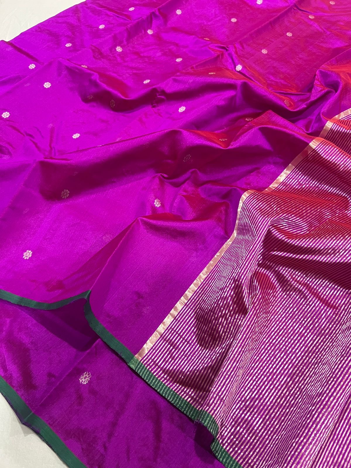 Vivid magenta handloom Pattu Silk Chanderi saree with metallic woven buttas, green edge and striped pallu