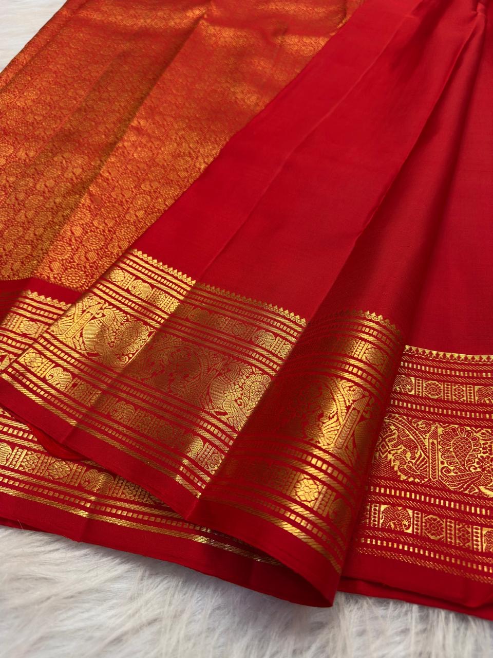 Vivid Red Kanjivaram silk saree with petite thanga-zari bird buttas