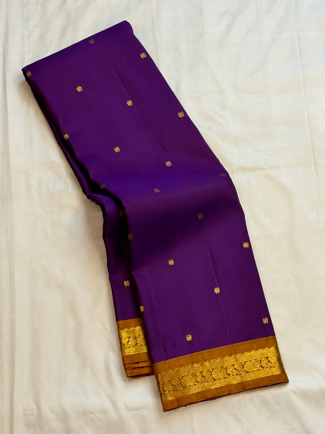 Vivid violet Pure Silk Kanjeevaram Butta saree with copper gold zari border