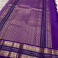 Warm beige pure silk Kanchipuram saree with regal violet korvai border – drape view