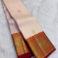 Warm Ivory pure silk Kanjeevaram Varisaipet saree with Arakku Red and antique-gold zari border.