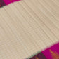 Warm Ivory Ettukol Kanchipuram silk body woven with fine gold checks and a vivid multicolour border.